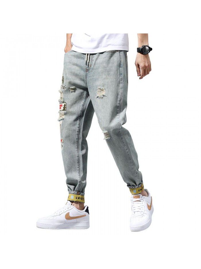 Holed jeans men's spring new fashion brand Slim small leg Harem Pants men's fashion casual corset Capris 