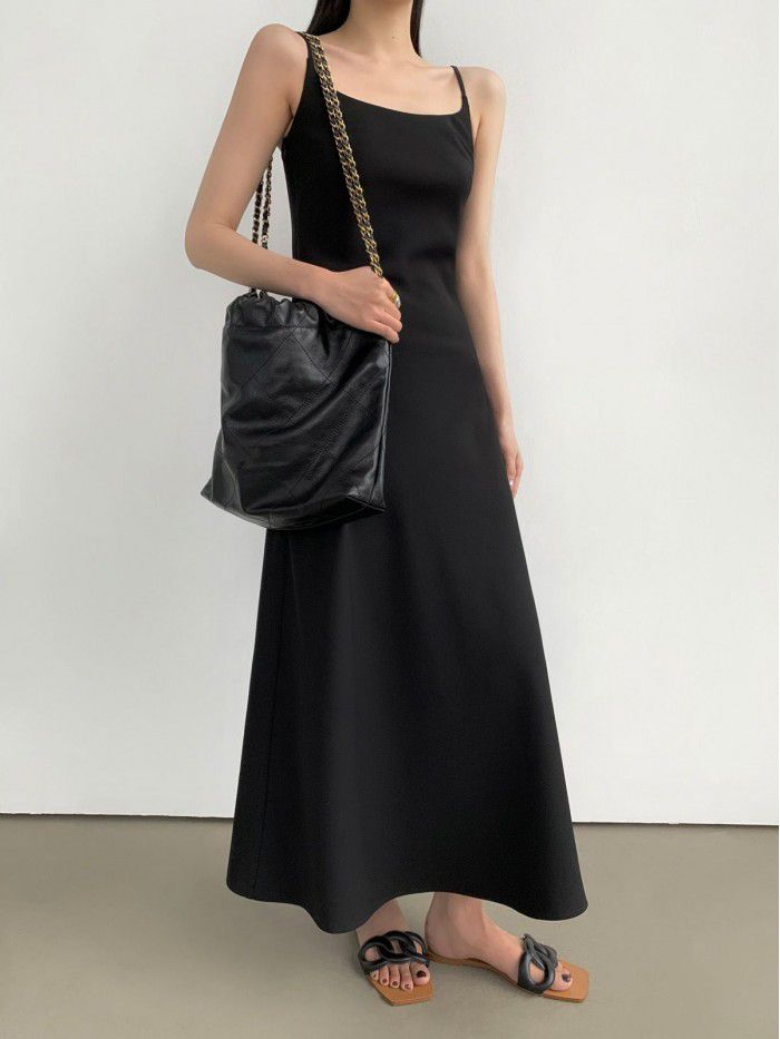 Black French suspender dress for women's new minimalist style diagonal cut long skirt  Black French suspender dress for women's new minimalist style diagonal cut long skirt